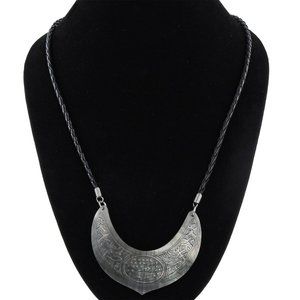 Shell dolphin carving and black suede string